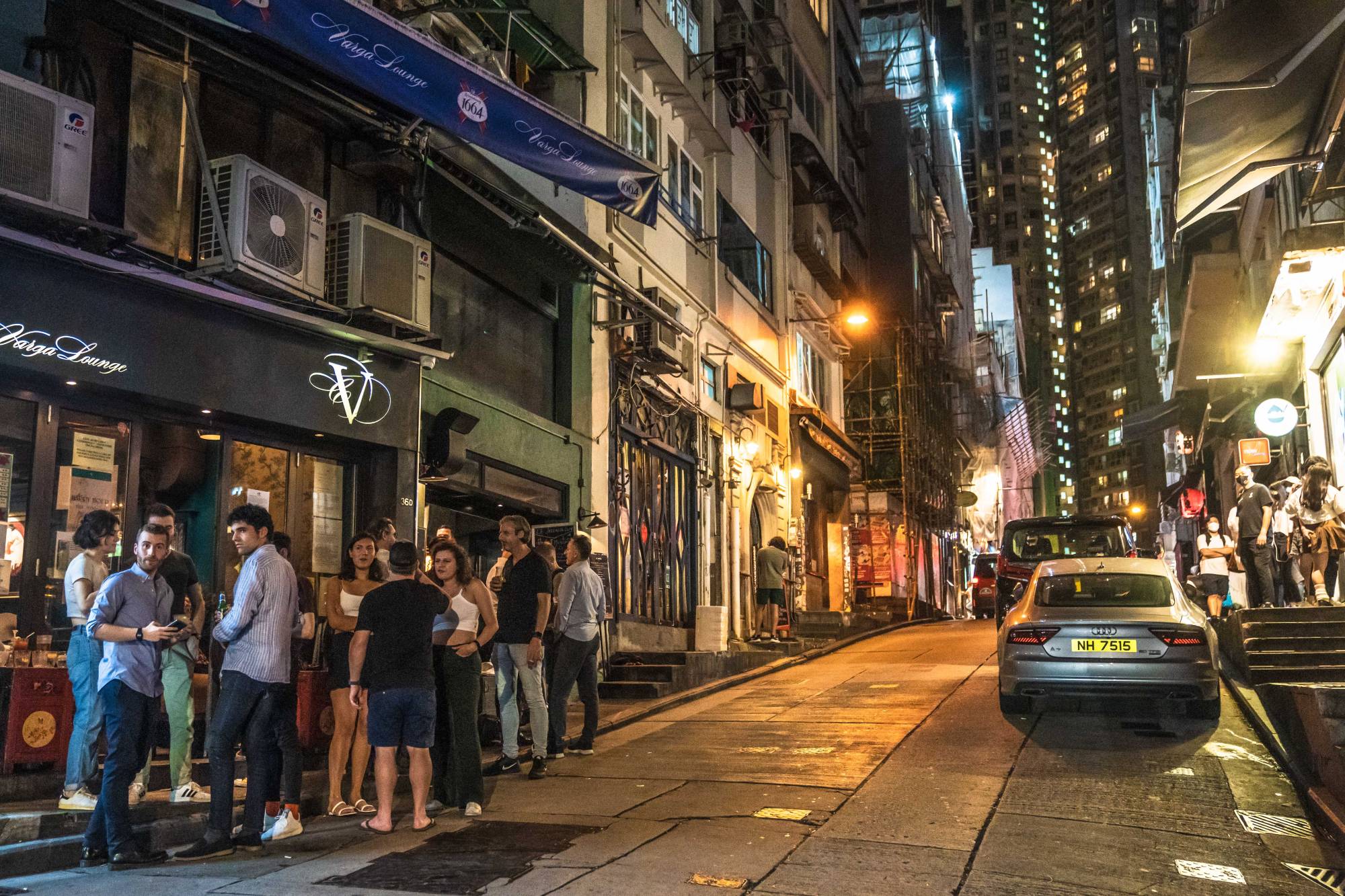 Customers outside a bar at the Lan Kwai Fong nightlife area in Hong Kong on Thursday.  | BLOOMBERG