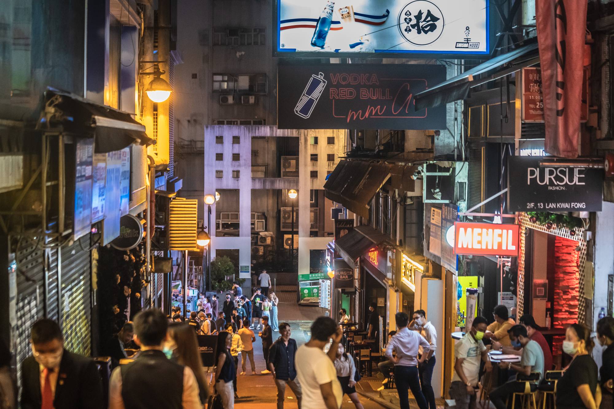 The Lan Kwai Fong nightlife area in Hong Kong on Thursday. The area was quieter than usual on the first day of a new COVID-19 rule that requires bar, pub and club patrons to show a negative test result to gain entry. | Bloomberg