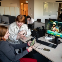 Inha Kushnir (left) and Nastya Dahno working at the headquarters of the game-maker Nordcurrent in Vilnius, Lithuania, on May 23. They were among the employees in Ukraine that were evacuated by the company as Russia invaded. | GORDON WELTERS / THE NEW YORK TIMES