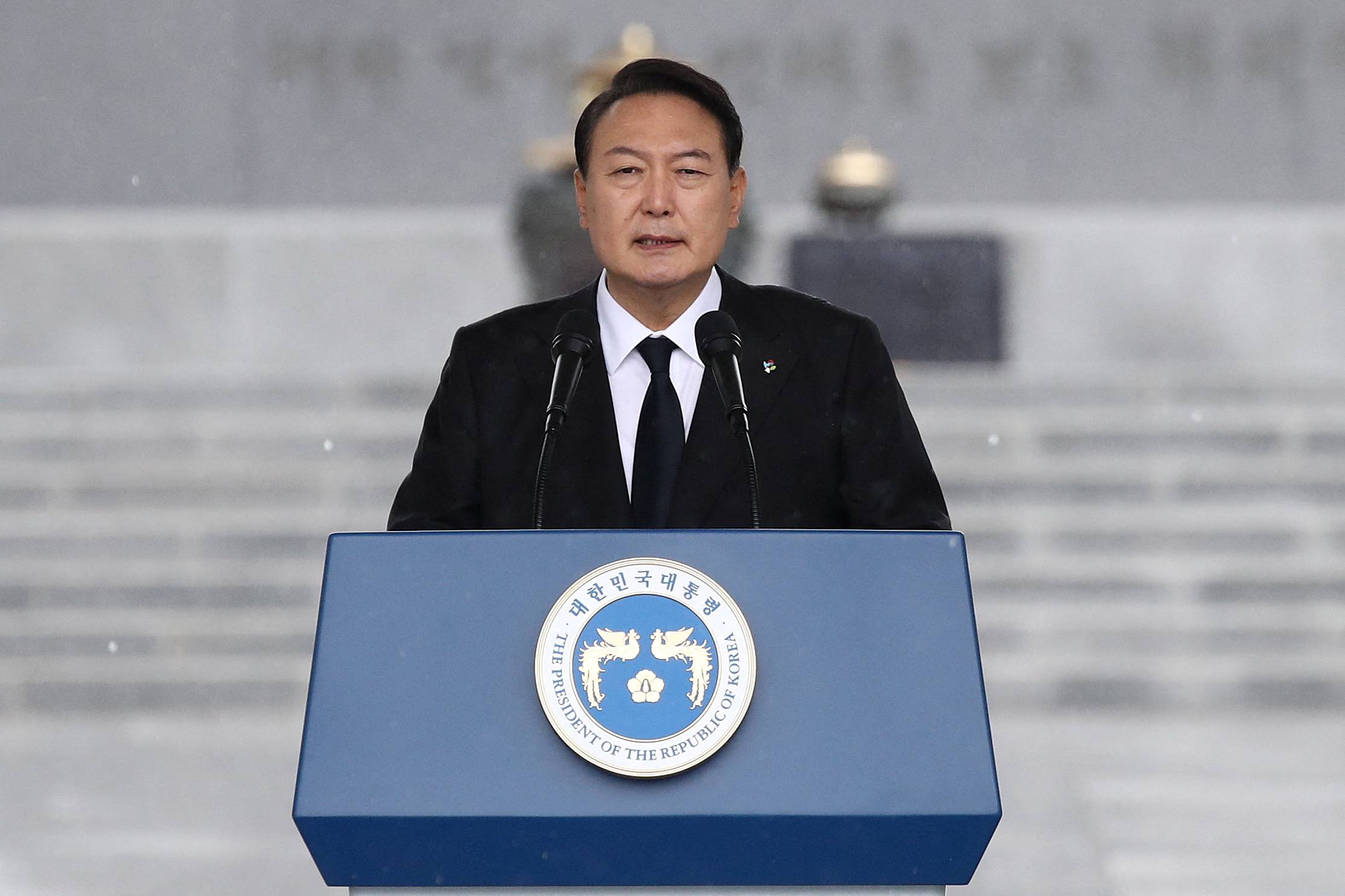 South Korean President Yoon Suk-yeol speaks in Seoul earlier this month. Japan, South Korea, Australia and New Zealand may hold a four-way summit on the fringes of a NATO meeting in Spain next week. | POOL / VIA REUTERS