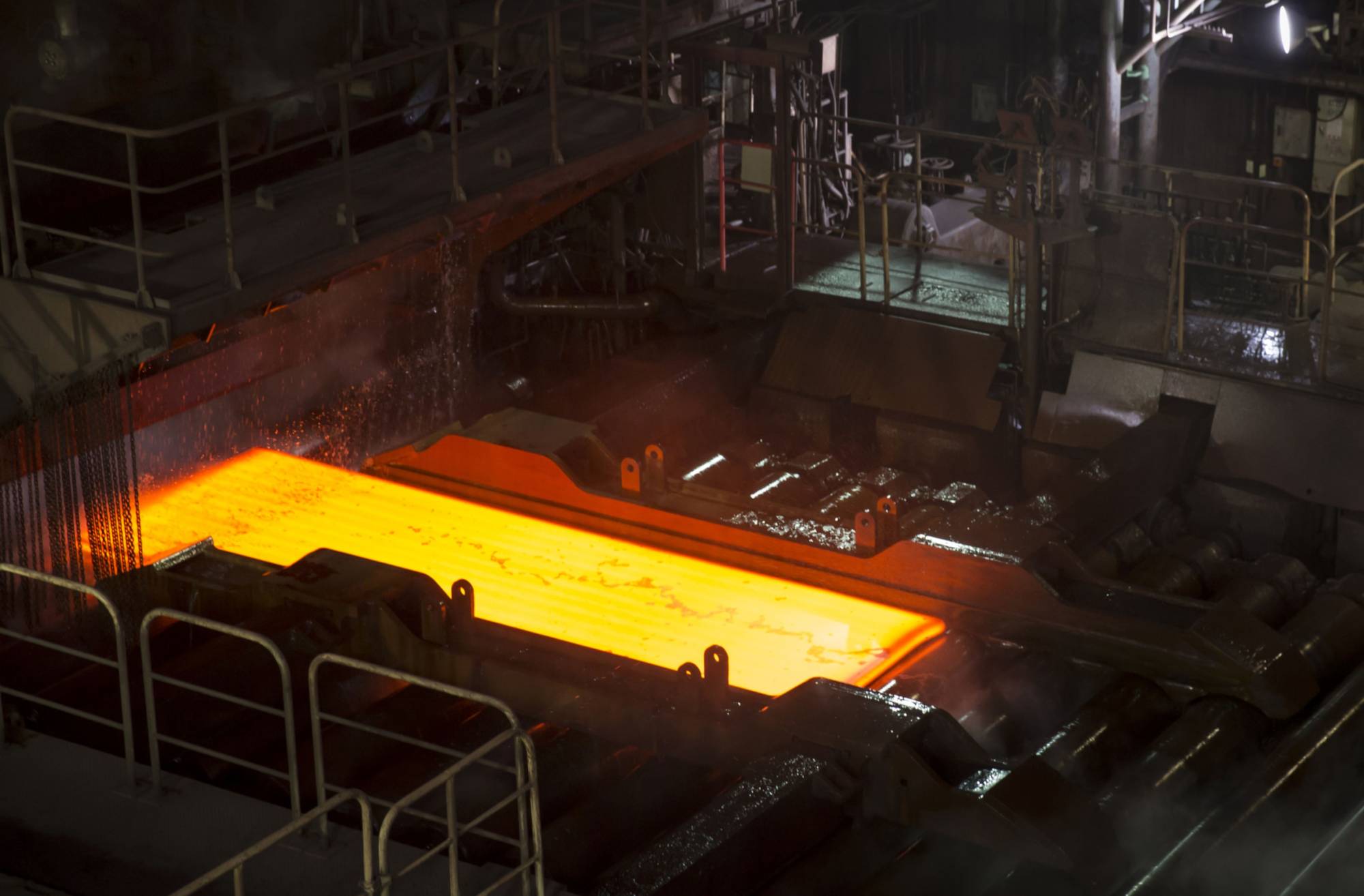 A hot steel slab moves along a conveyor at a Nippon Steel plant in Kashima, Ibaraki Prefecture. | Bloomberg