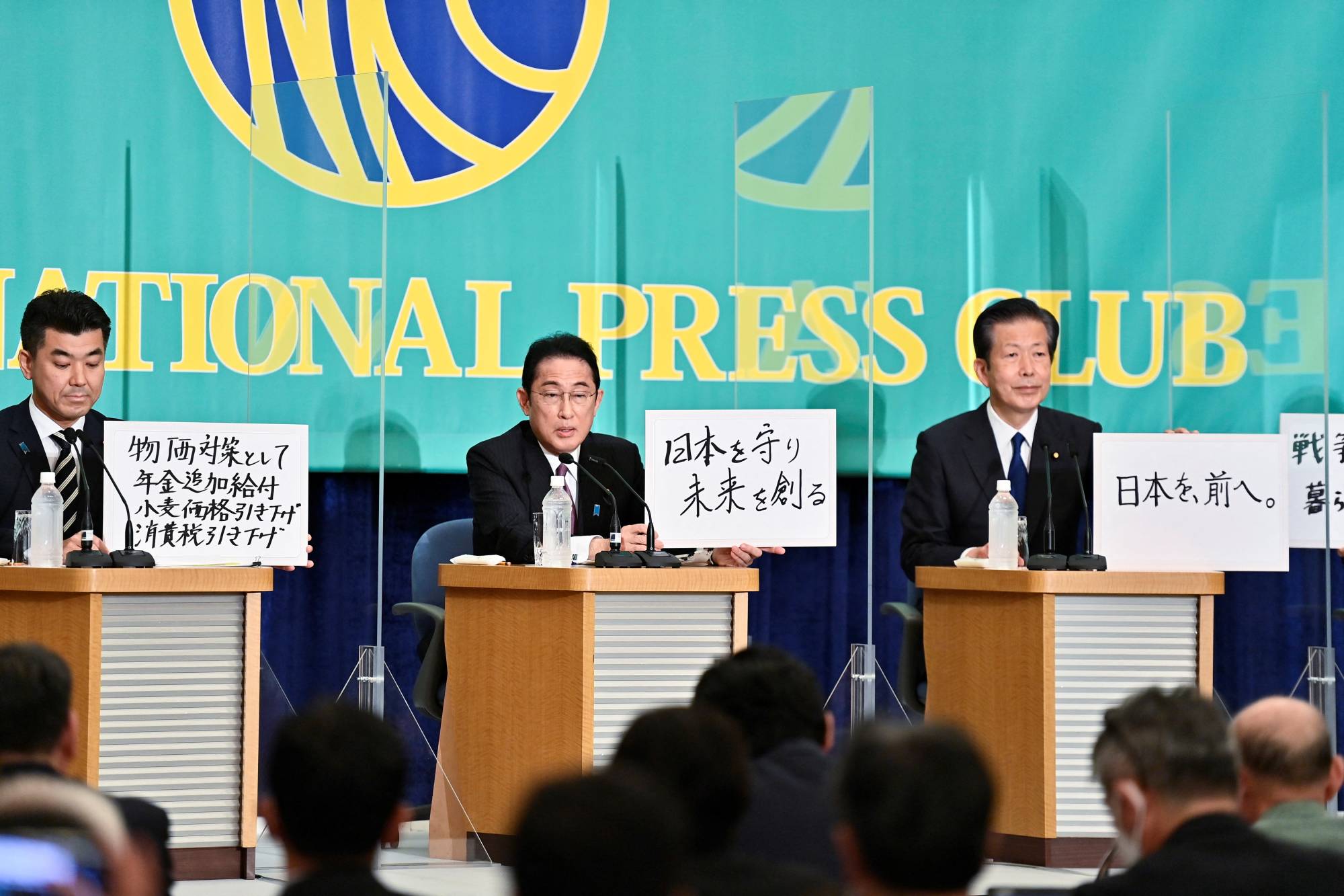 Constitutional Democratic Party of Japan leader Kenta Izumi (left), Prime Minister and Liberal Democratic Party head Fumio Kishida and Komeito chief Natsuo Yamaguchi attend a debate in Tokyo on Tuesday ahead of the July 10 Upper House election. | POOL / VIA REUTERS