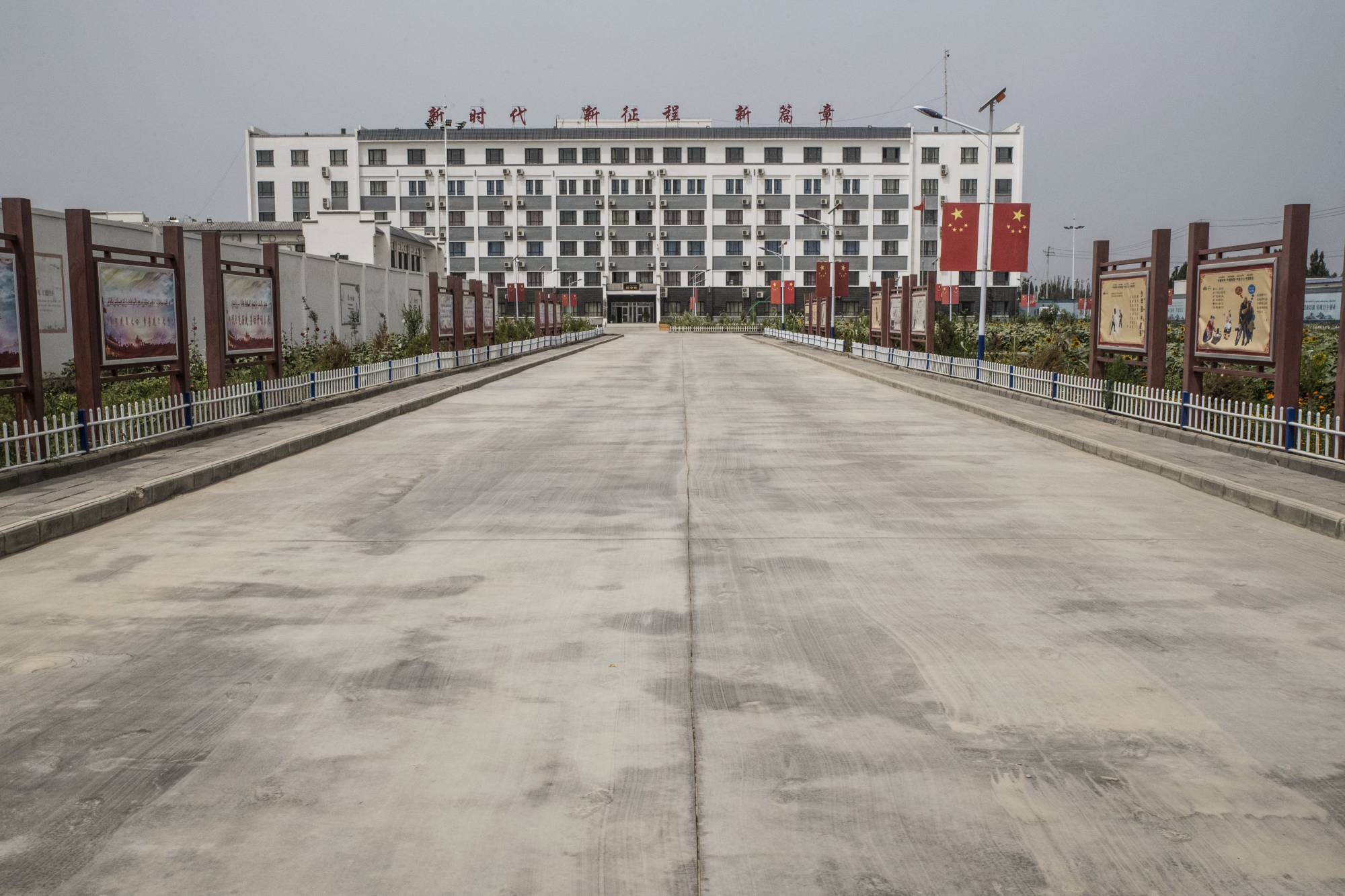 The entrance to an indoctrination center in Hotan, China on Aug. 4, 2019. In 2017, the regional government announced plans to transfer 100,000 people from the cities of Kashgar and Hotan in southern Xinjiang into new jobs.  | GILLES SABRIE / THE NEW YORK TIMES