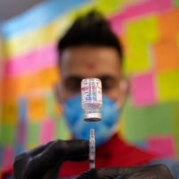 Dr. Mayank Amin draws the Moderna COVID-19 vaccine to be given to children under 5-years, at Skippack Pharmacy in Schwenksville, Pennsylvania, on Monday. | REUTERS