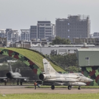Warplanes prepare to take off at Hsinchu Military Air Base in Hsinchu, Taiwan, on May 18. Taiwan scrambled jets on Tuesday to warn away 29 Chinese aircraft in its air defense zone. | LAM YIK FEI / THE NEW YORK TIMES