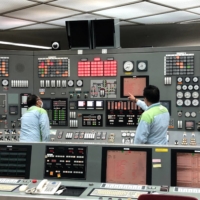 Employees work as Japan\'s biggest power generator JERA prepares to restart some of its aged units at the Anegasaki gas-fired power station, on Wednesday. | REUTERS