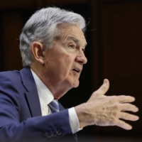 U.S. Federal Reserve Chairman Jerome Powell speaks during a Senate Banking, Housing, and Urban Affairs Committee hearing in Washington, on Wednesday. Powell said the central bank will keep raising interest rates to tame inflation following the steepest hike in almost three decades. | BLOOMBERG