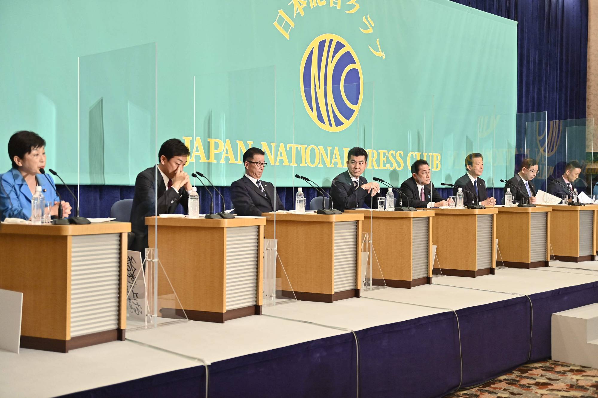 Prime Minister Fumio Kishida (fifth from left) and other party leaders take part in a debate in Tokyo on Tuesday in preparation for the July 10 Upper House elections. | POOL / AFP-JIJI