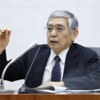 Bank of Japan Gov. Haruhiko Kuroda speaks during a news conference at the central bank\'s headquarters in Tokyo last week. | BLOOMBERG