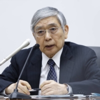Bank of Japan Gov. Haruhiko Kuroda speaks during a news conference at the central bank\'s headquarters in Tokyo on June 17. | BLOOMBERG