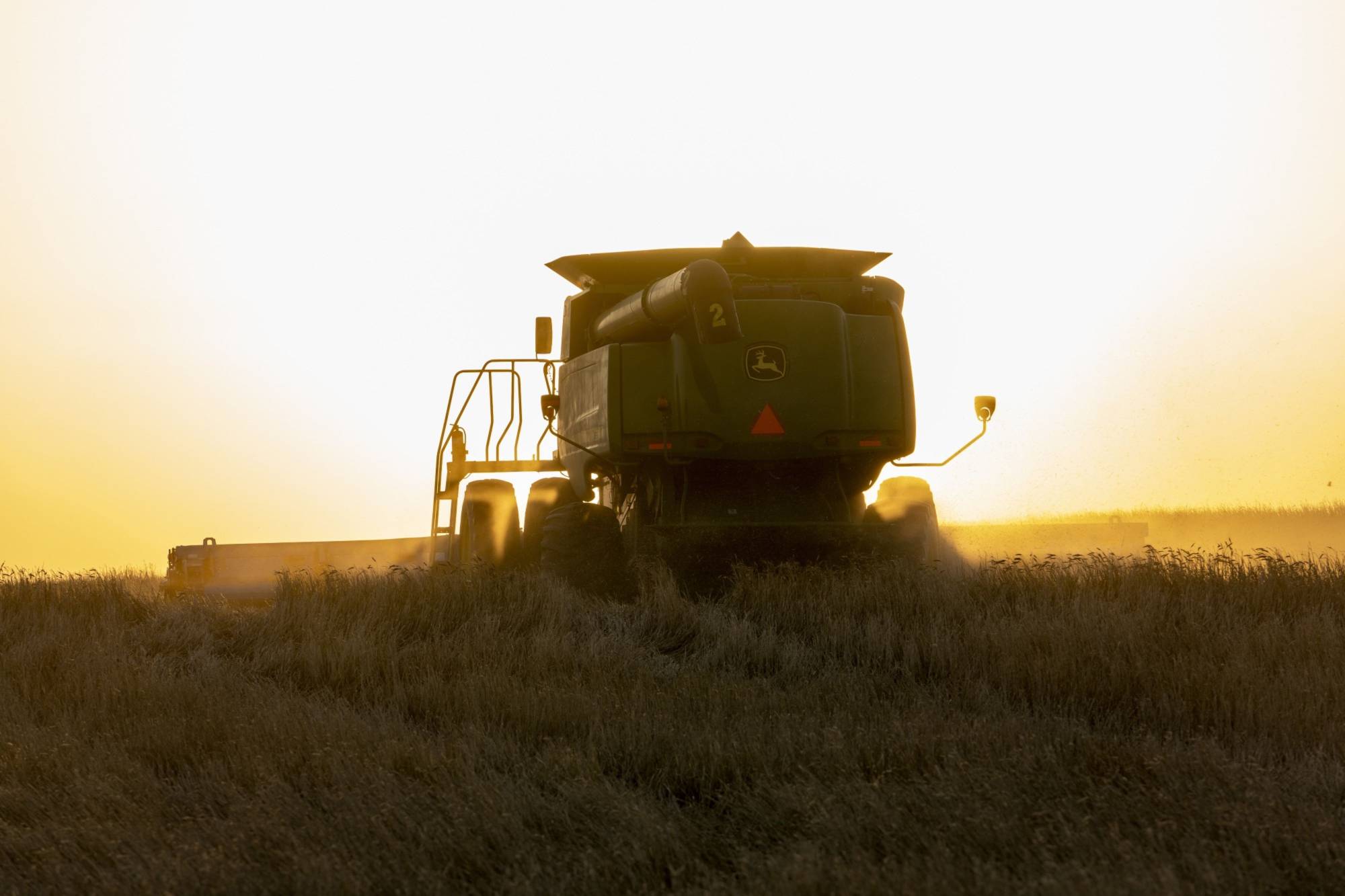 A combine harvests winter wheat in Corn, Oklahoma, on June 15. | Bloomberg 