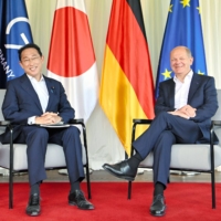 Prime Minister Fumio Kishida and German Chancellor Olaf Scholz hold talks in Schloss Elmau, Germany, on Sunday. | POOL / VIA KYODO