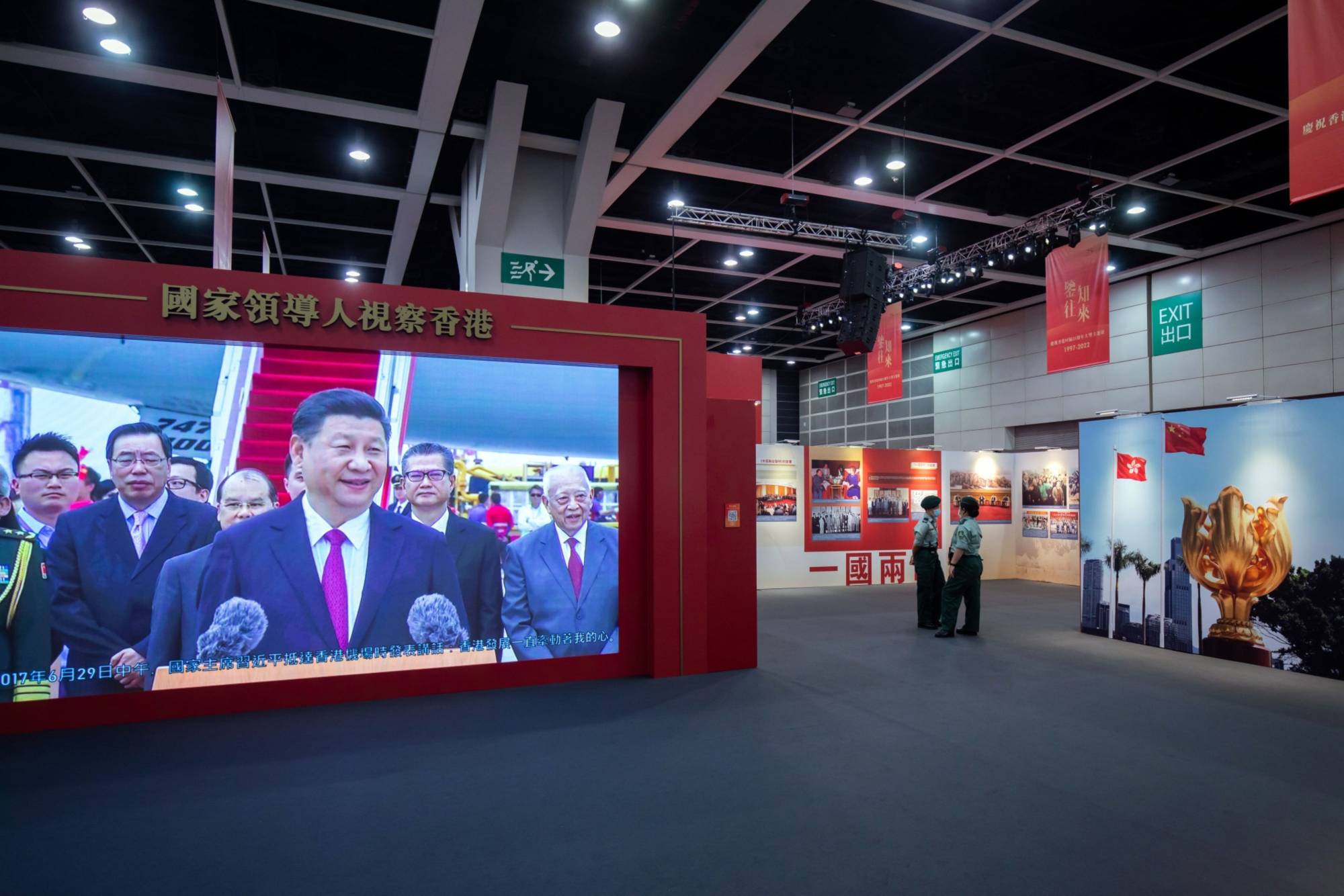 A screen showing a video featuring Xi Jinping at an exhibition in Hong Kong on June 22.  | BLOOMBERG