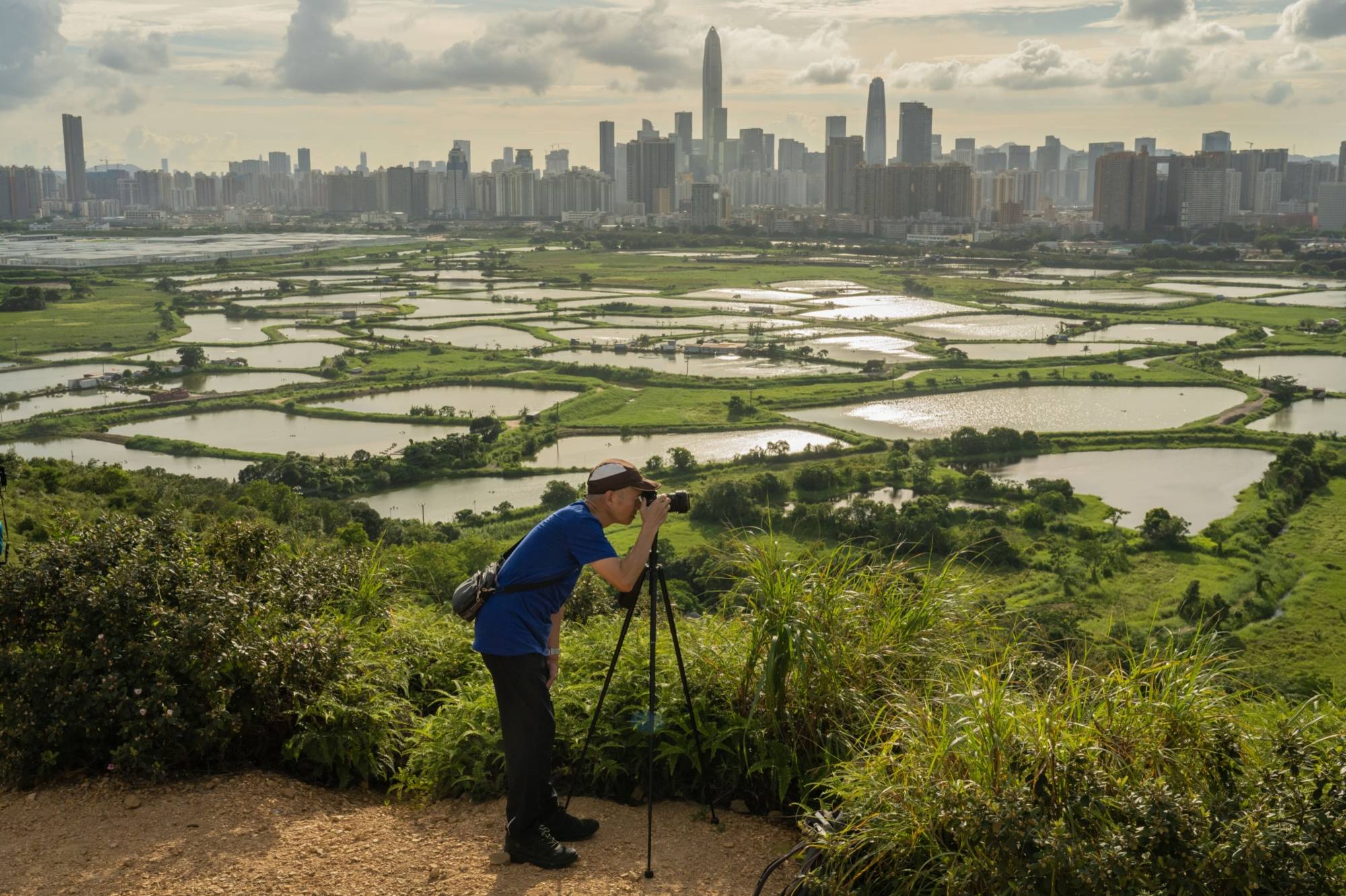 Farmland in the Lok Ma Chau area of Hong Kong, across the border from the technology hub of Shenzhen on the mainland. Initiatives such as the Greater Bay Area will bind the city better to Shenzhen and the former Portuguese colony of Macau. | Bloomberg 