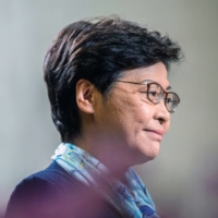 Outgoing Chief Executive Carrie Lam has said privately that she doesn’t have the power to eliminate quarantine, even though she personally wants to open up to international travel. | BLOOMBERG 