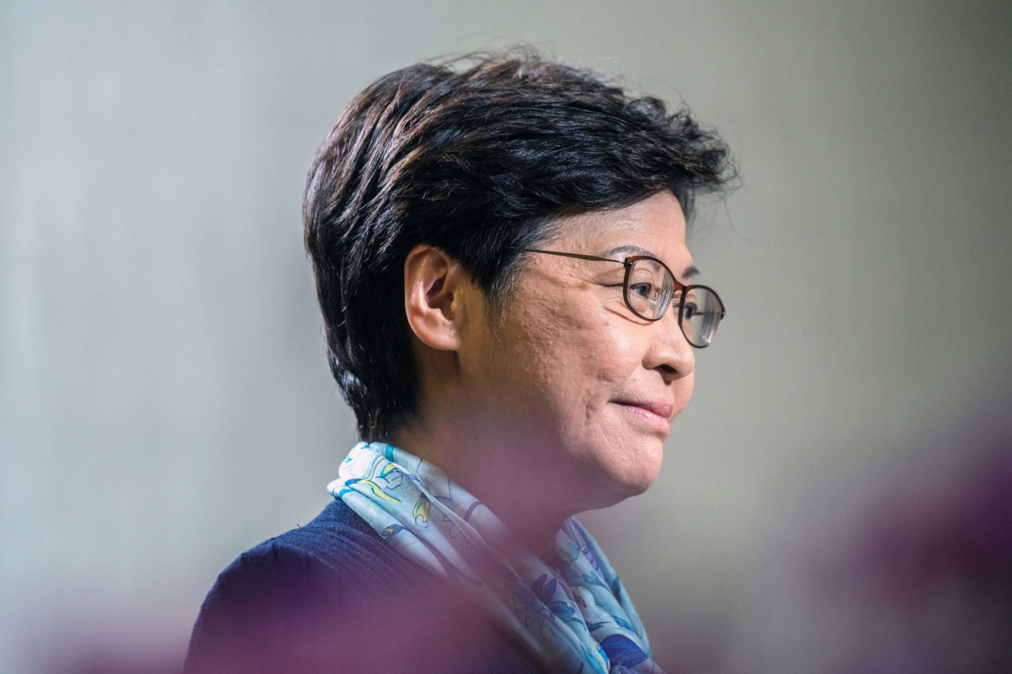 Outgoing Chief Executive Carrie Lam has said privately that she doesn’t have the power to eliminate quarantine, even though she personally wants to open up to international travel. | Bloomberg 