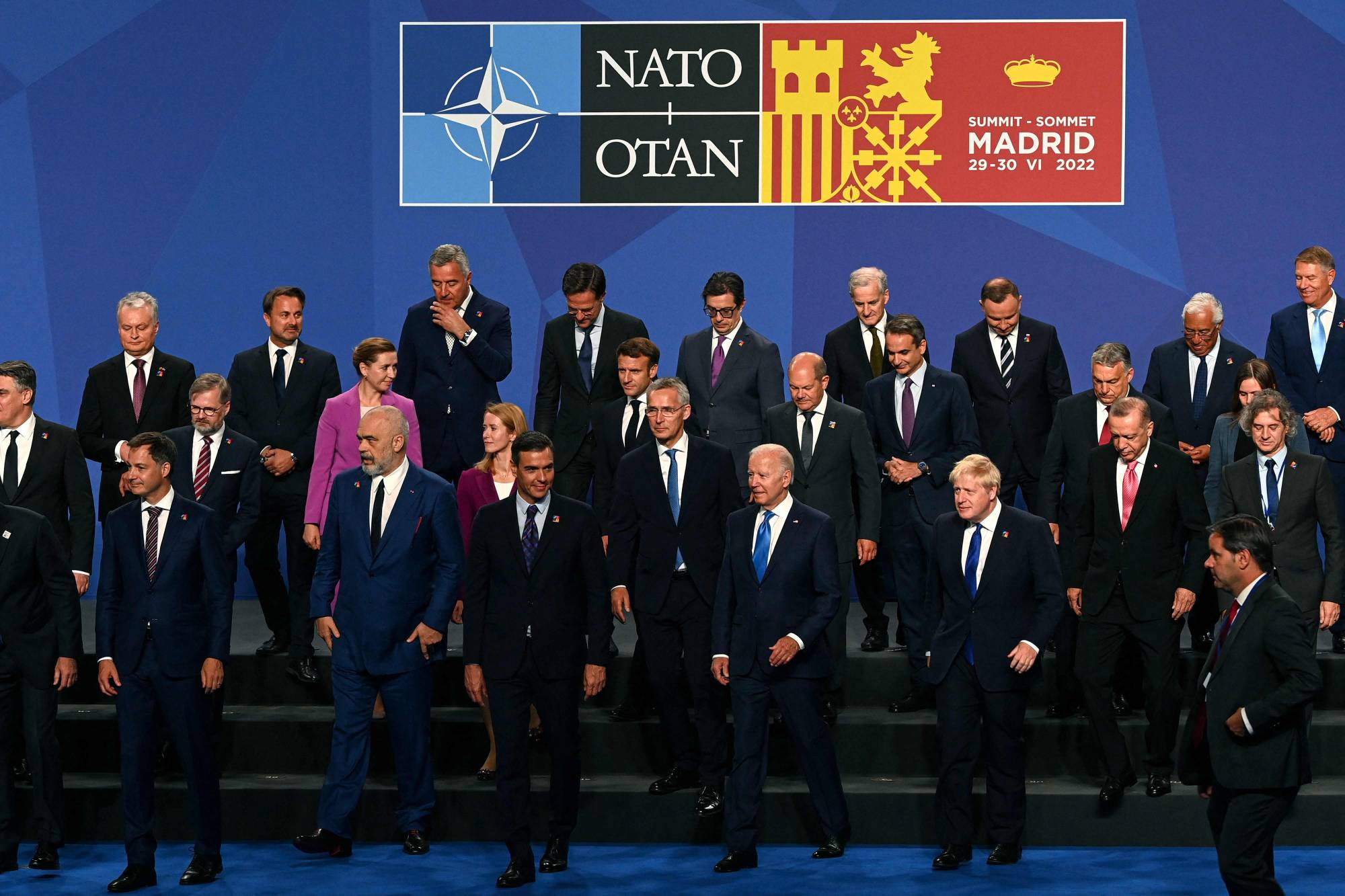Leaders of NATO member states depart after posing for an official group photograph during the alliance's summit in Madrid on Wednesday. | POOL / VIA AFP-JIJI