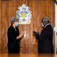 Australian Foreign Minister Penny Wong meets Solomon Islands Prime Minister Manasseh Sogavare in Honiara, Solomon Islands, on June 17. | AUSTRALIA DEPARTMENT OF FOREIGN AFFAIRS AND TRADE / VIA REUTERS