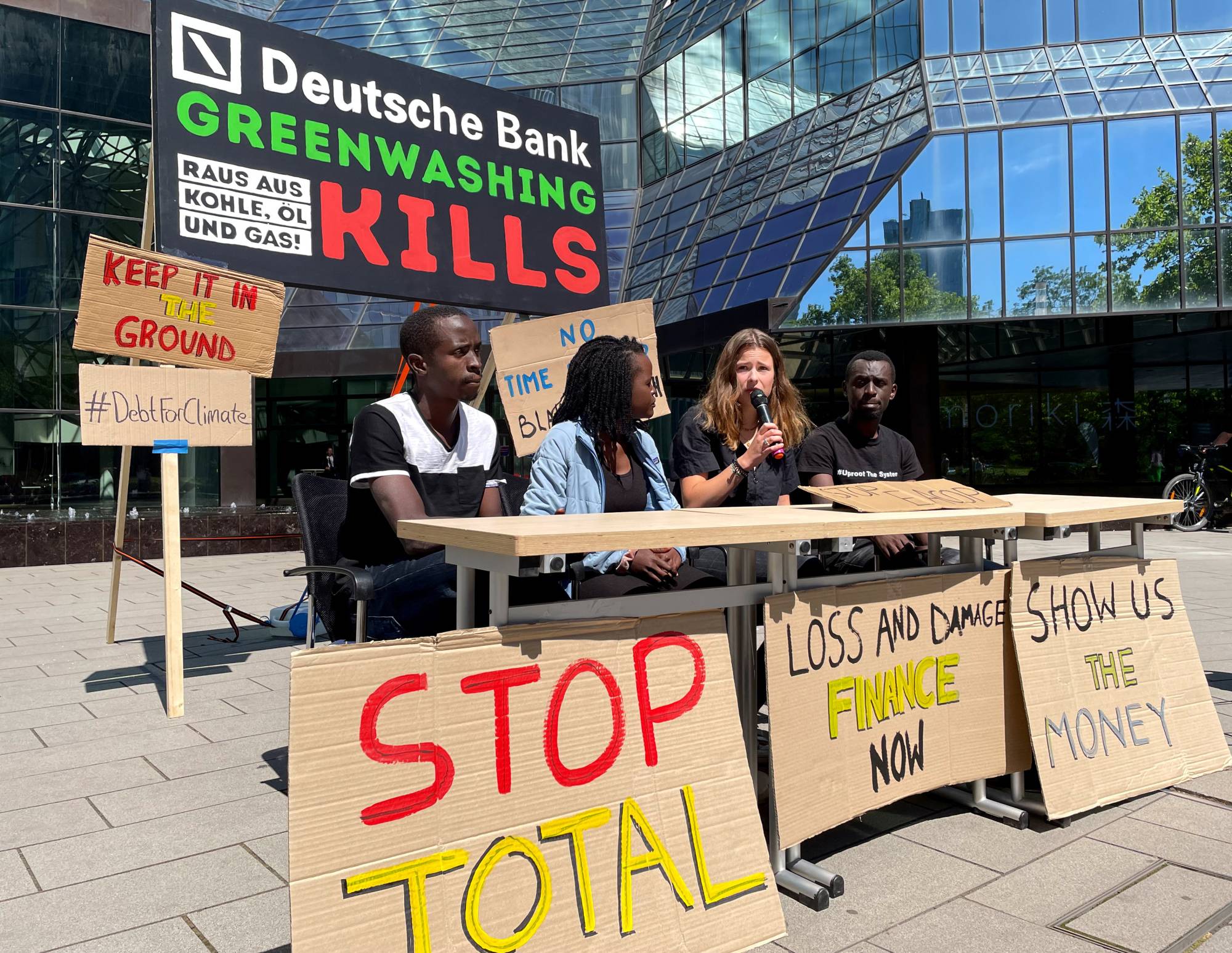 Fridays for Future activist Luisa Neubauer speaks in front of the Deutsche Bank headquarters in Frankfurt on June 28.  | REUTERS 
