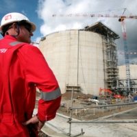 An employee of Sakhalin Energy stands at the Sakhalin-2 project\'s liquefaction gas plant in Prigorodnoye, about 70 km south of Yuzhno-Sakhalinsk, Russia, in October 2006.  | REUTERS