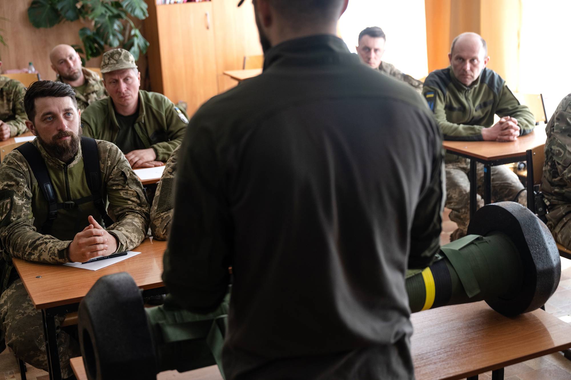 An American volunteer teaches Ukrainian soldiers how to use a Javelin anti-tank missile at a base outside of Zaporizhzhia, Ukraine, on April 28. Special Operations veterans are training Ukrainians near the front lines in the fight against Russia, despite warnings from the Pentagon. | Lynsey Addario / The New York Times