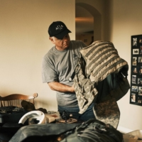 Perry Blackburn Jr., who recently returned from Ukraine, organizes supplies as he prepared for his next trip to the country, in Tampa, Florida, on June 24. Special Operations veterans are training Ukrainians near the front lines in the fight against Russia, despite warnings from the Pentagon. | ZACK WITTMAN / THE NEW YORK TIMES