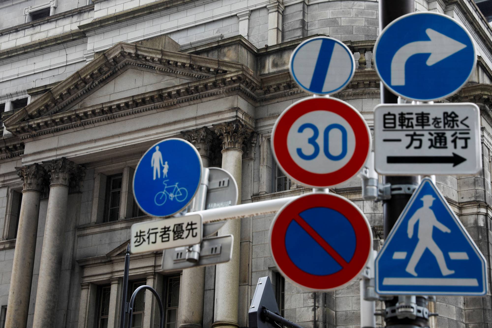 In June, the Bank of Japan owned a record 50.4% of outstanding Japanese government bonds issued in the market, up from 49.7% in May, according to estimates by Mitsubishi UFG Morgan Stanley Securities. | REUTERS