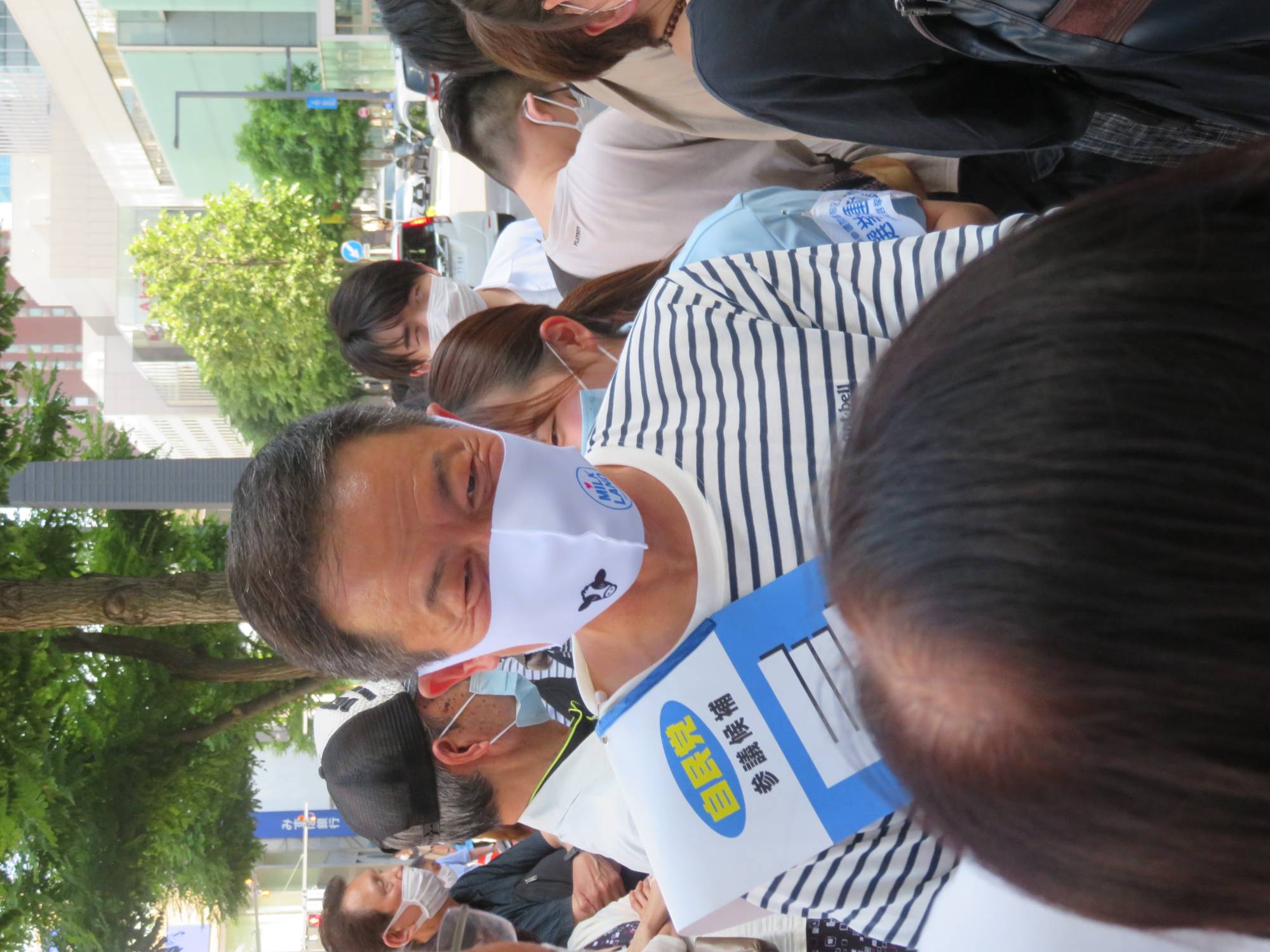 LDP candidate Gaku Hasegawa meets and greets supporters just before an appearance with Kishida on Sunday. | Eric Johnston 