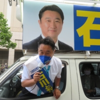 Constitutional Democratic Party of Japan candidate Tomohiro Ishikawa campaigns in Sapporo on June 26. | ERIC JOHNSTON
