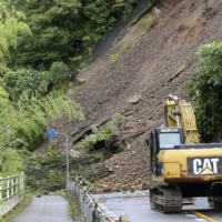 A road was blocked by a landslide in Nakatosa, Kochi Prefecture, on Tuesday due to Tropical Storm Aere. | KYODO