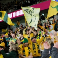 Australia fans cheer before a World Cup qualifier against Saudi Arabia in Sydney on Nov. 11. | REUTERS