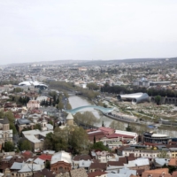 The Mtkvari River flows through the center of Tbilisi, Georgia, in April 2014. Georgia’s government estimates that 80,000 Russians, Belarusians and Ukrainians now reside in this small nation of 4 million. | BLOOMBERG