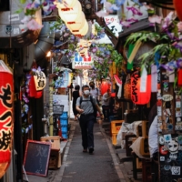 Restaurants along a street in Tokyo on Wednesday  | REUTERS