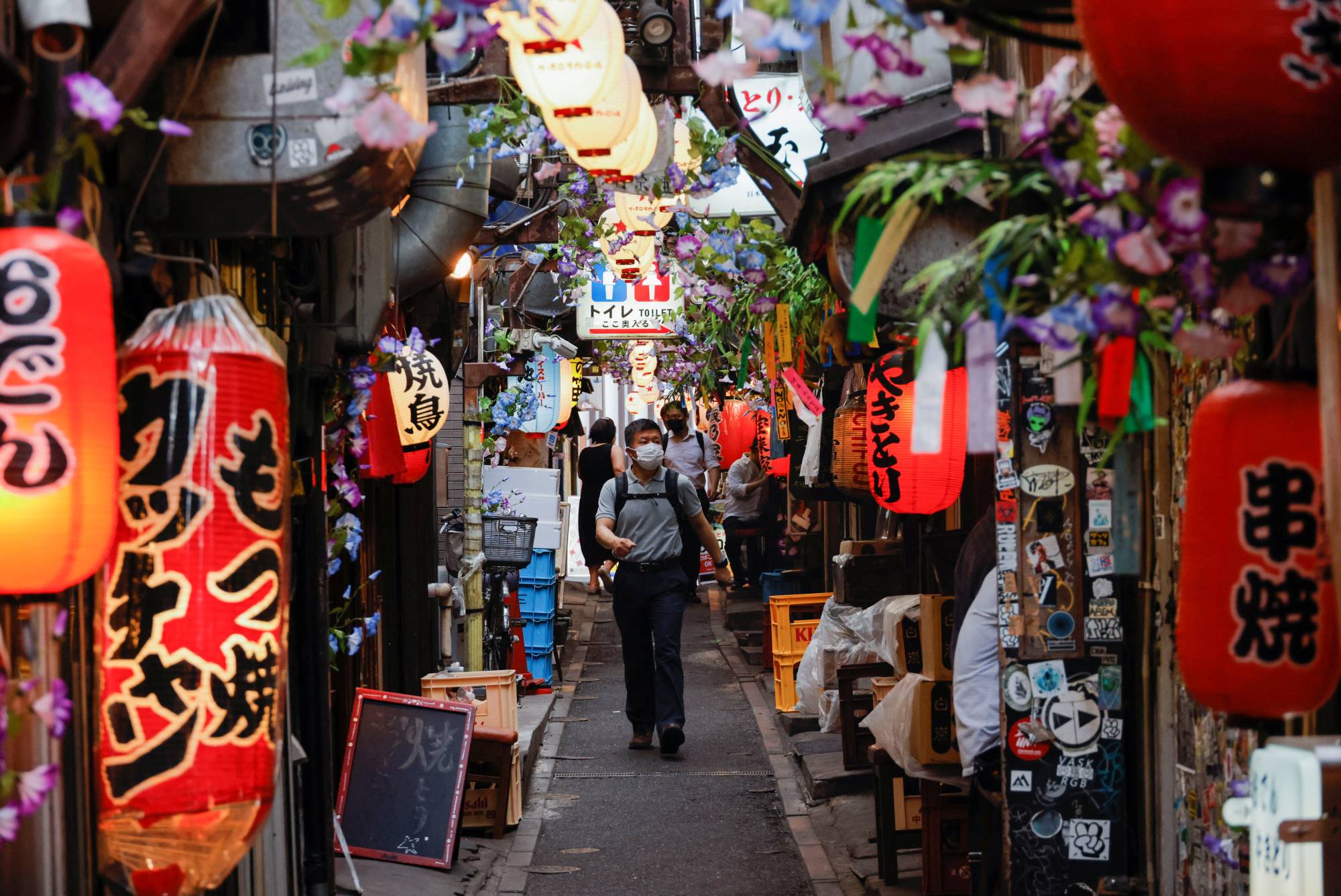 Restaurants along a street in Tokyo on Wednesday | Reuters