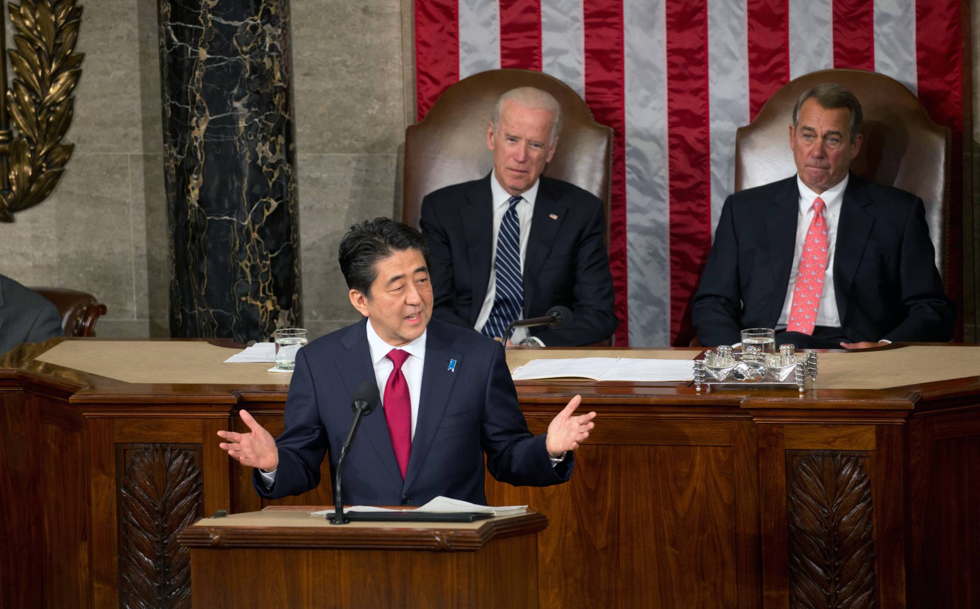 Then-Prime Minister Shinzo Abe addresses a joint session of the U.S. Congress as then-Vice President Joe Biden (left) and House Speaker John Boehner look on in Washington in Apri 2015.  | STEPHEN CROWLEY / THE NEW YORK TIMES