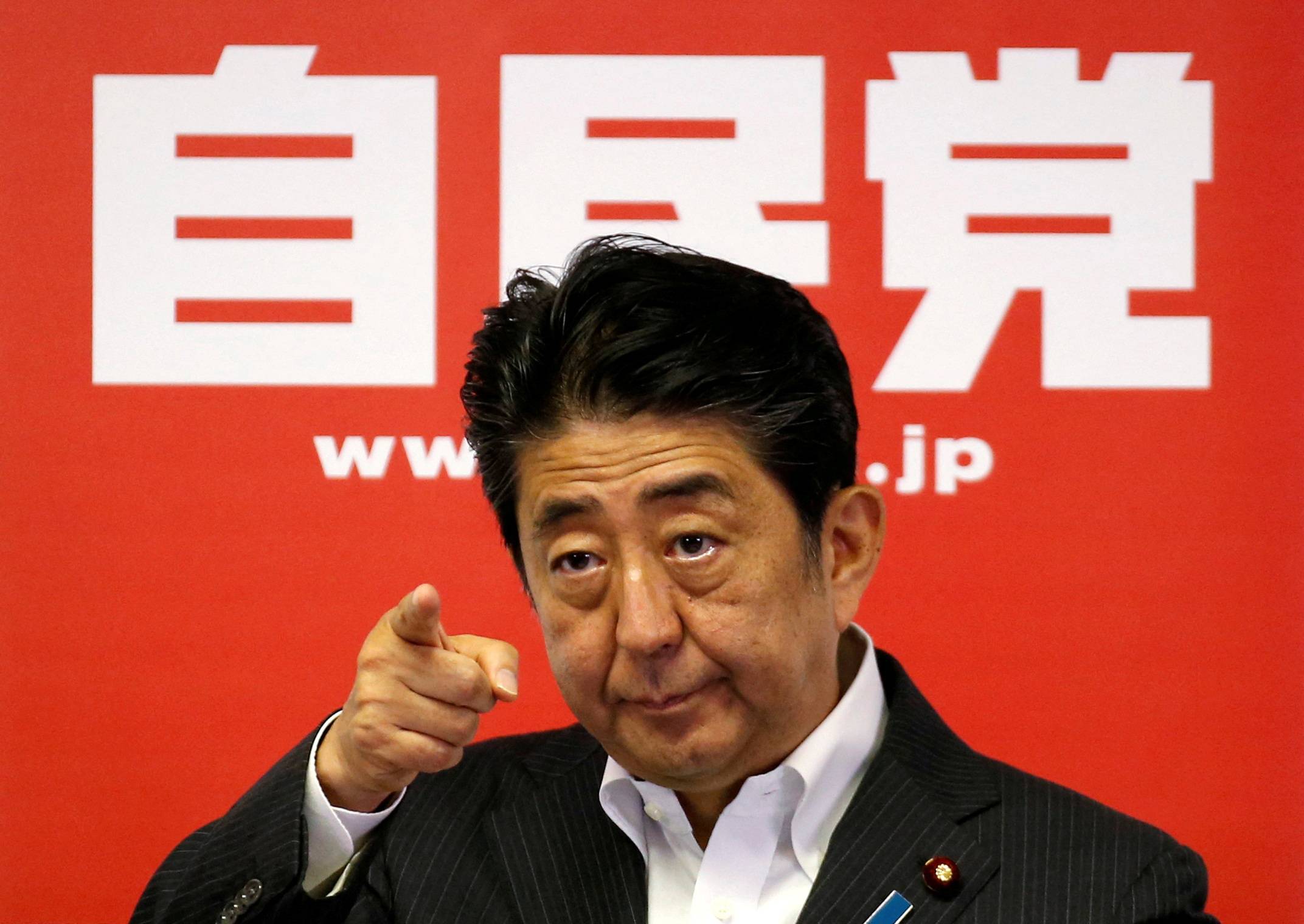 Abe at LDP headquarters following a victory in the Upper House election by his ruling coalition in 2016 | REUTERS