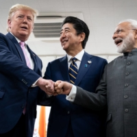 Prime Minister Shinzo Abe chats with U.S. President Donald Trump and Indian Prime Minister Narendra Modi at the G20 summit in Osaka in 2019. | ERIN SCHAFF / THE NEW YORK TIMES