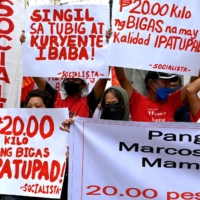 Protesters stage a rally in Manila on July 4 calling on Marcos Jr. to bring down the price of rice. | AFP-JIJI