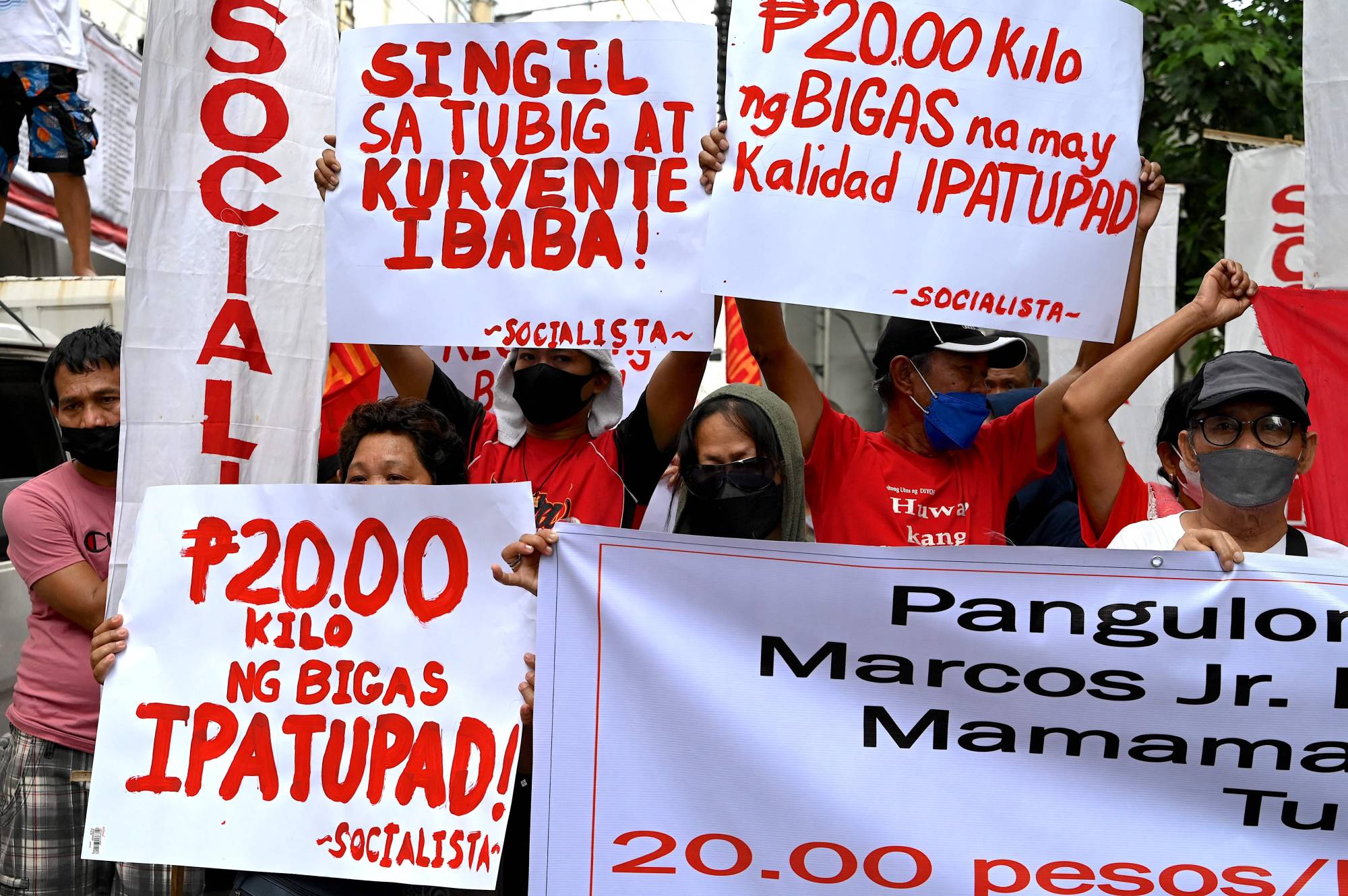 Protesters stage a rally in Manila on July 4 calling on Marcos Jr. to bring down the price of rice. | AFP-Jiji