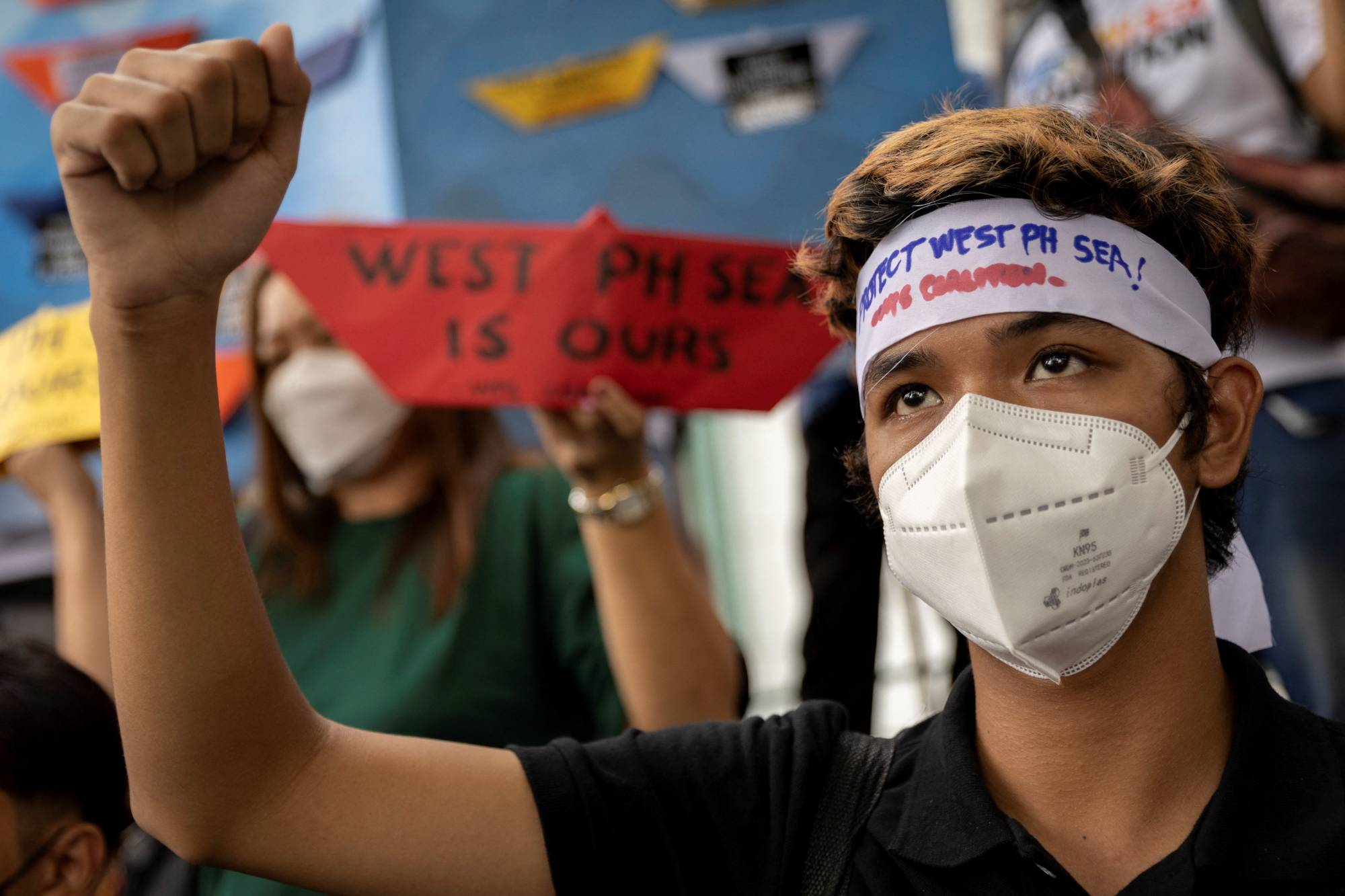 Filipino activists stage a protest outside the Chinese consular office in Makati City, Philippines, on the sixth anniversary of an international tribunal ruling that invalidated China's historical claims in the South China Sea. | Reuters 