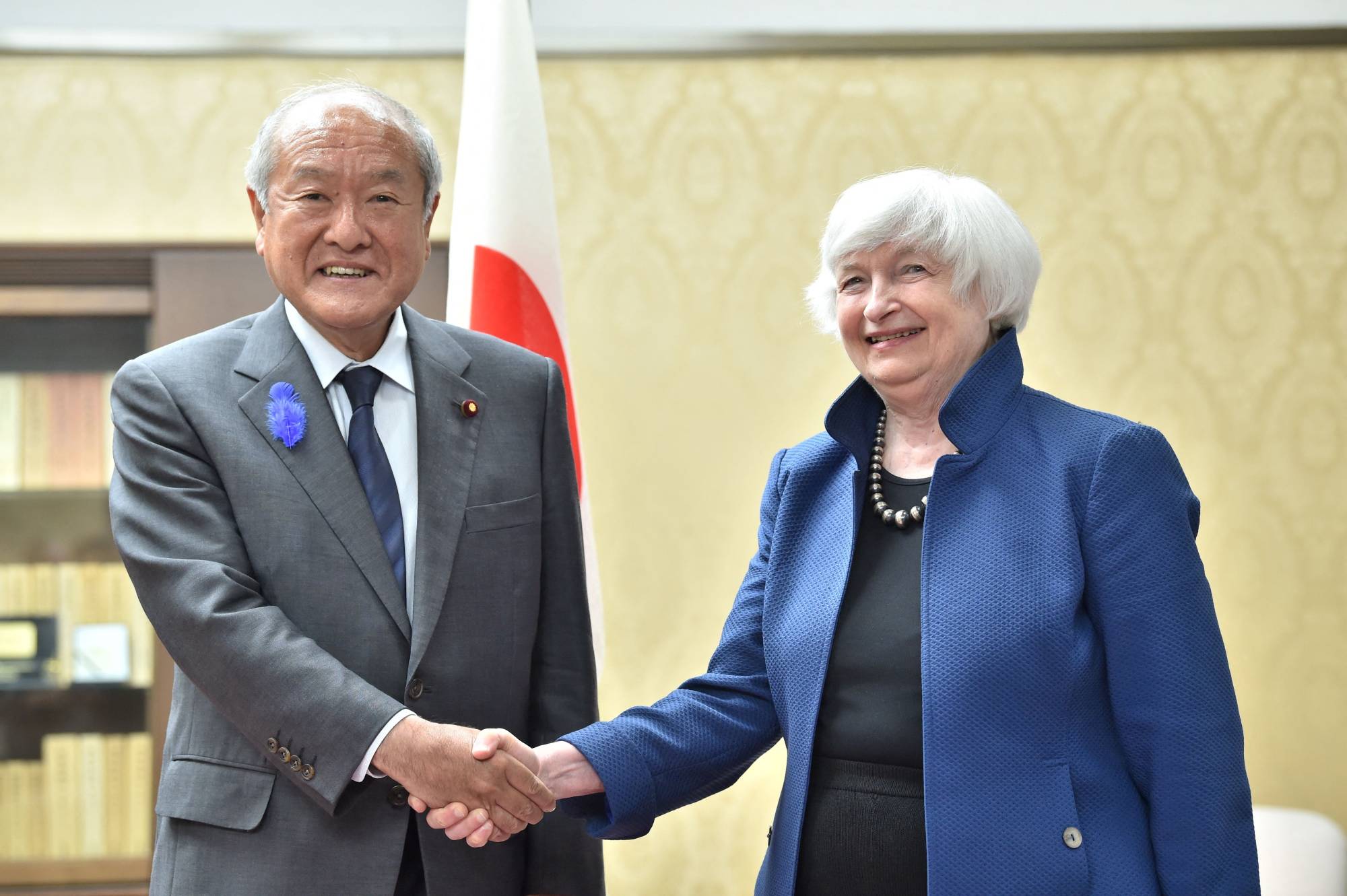 Finance Minister Shunichi Suzuki meets with U.S. Treasury Secretary Janet Yellen in Tokyo on Tuesday. | AFP-JIJI