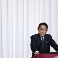 Kishida speaks during a news conference in Tokyo on Monday. Despite newfound political capital following the Upper House election, there is uncertainty about exactly what it is that Kishida wants to do over his \"new capitalism\" agenda. | BLOOMBERG