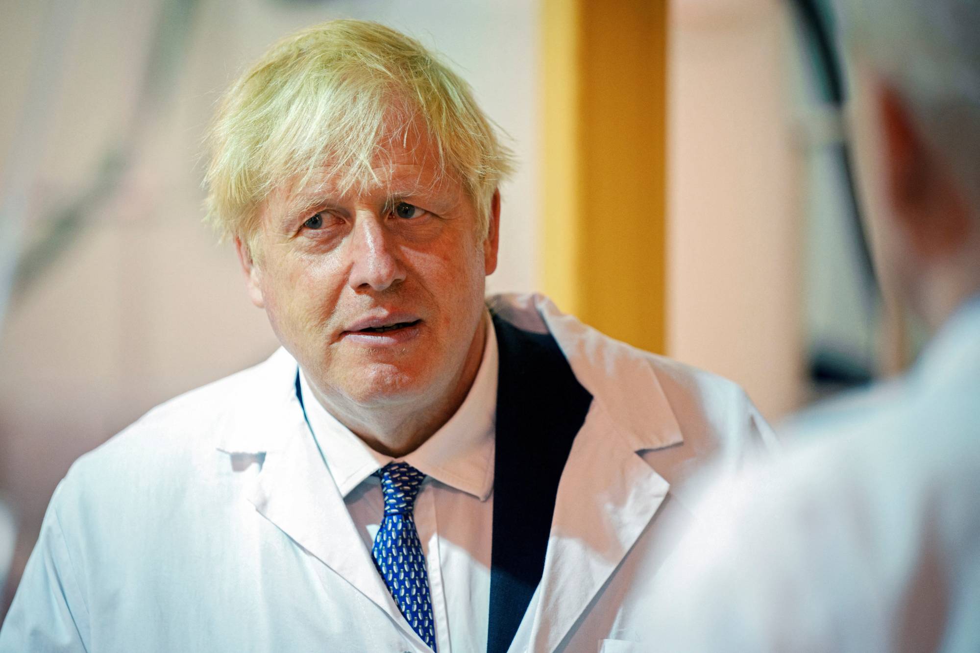 British Prime Minister Boris Johnson visits the Francis Crick Institute in London on Monday. | Pool / via REUTERS