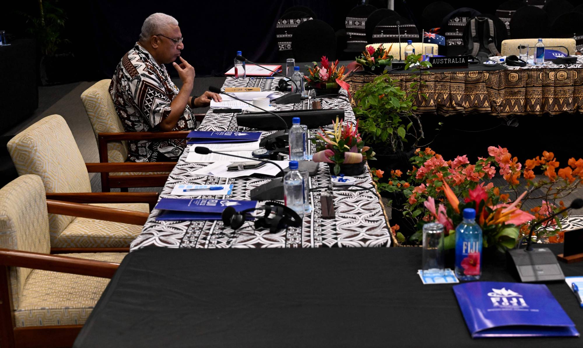 Fiji Prime Minister Frank Bainimarama goes over his notes during the Pacific Islands Forum in Suva on Wednesday. | AFP-JIJI