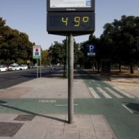 A thermometer displays a 49 degree Celsius reading during the second heat wave of the year, in Seville, Spain, on Wednesday. | REUTERS