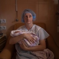 Katya Buravtsova, 35, holds her son Illiusha inside the Pokrovsk maternity hospital on June 29. Buravtsova\'s second child, Illiusha, was born early, delivered at only 28 weeks. | REUTERS