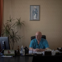 Doctor Ivan Tsyganok, 56, sits at his desk inside Pokrovsk maternity hospital on June 28.  | REUTERS