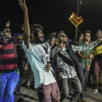Protesters in Colombo, Sri Lanka, cheer upon receiving word that Sri Lanka’s President Gotabaya Rajapaksa has resigned on Thursday. | ATUL LOKE / THE NEW YORK TIMES