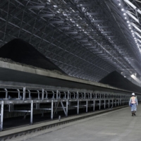 Coal at the indoor storage yard of the No. 5 unit of Jera\'s Taketoyo coal and biomass co-firing thermal power plant in Taketoyo, Aichi Prefecture, on Thursday. | BLOOMBERG