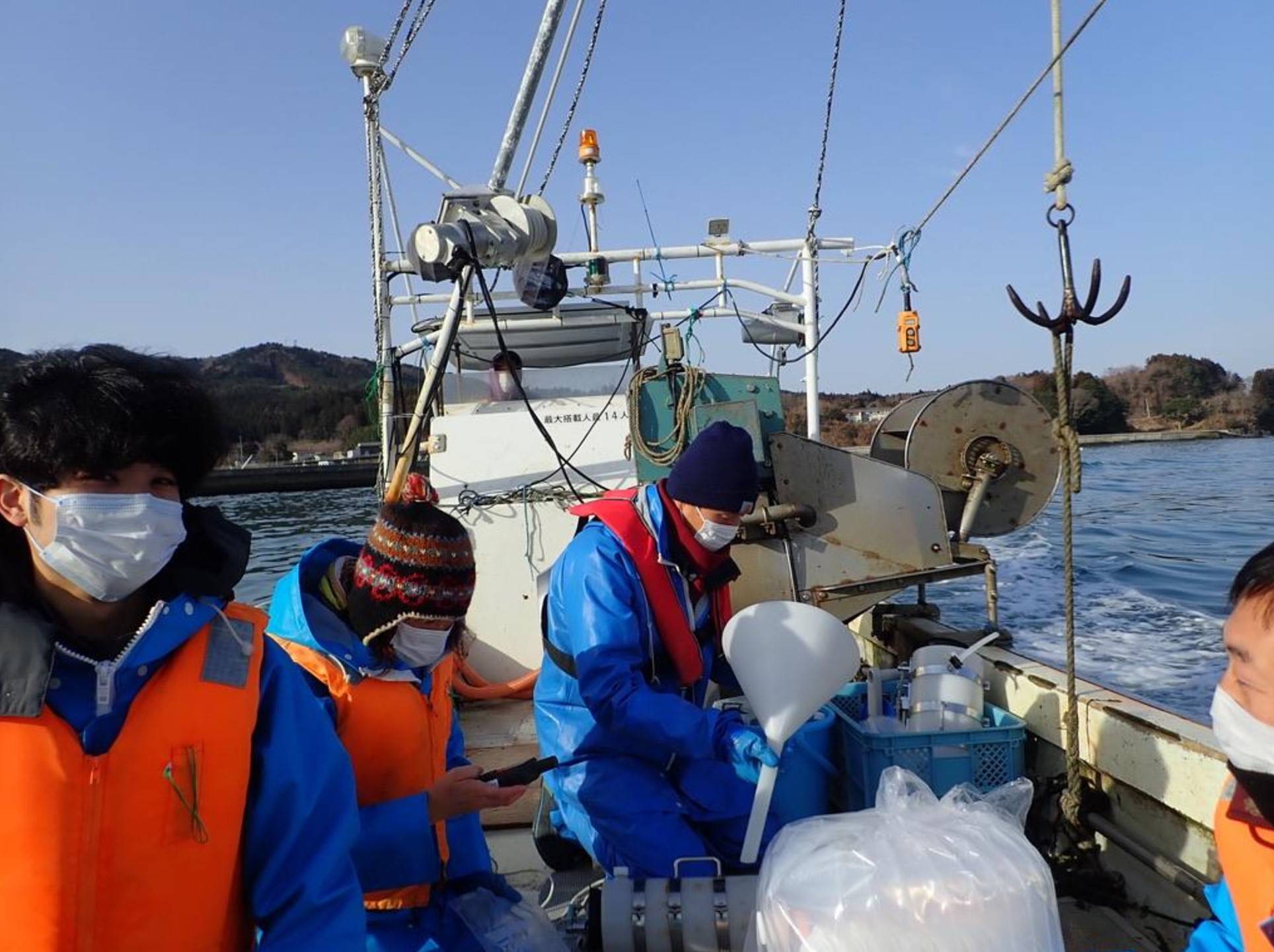 Kurihara and her colleagues conduct a field survey in the sea near Shizugawa Bay in Miyagi Prefecture in March. | COURTESY OF HARUKO KURIHARA 